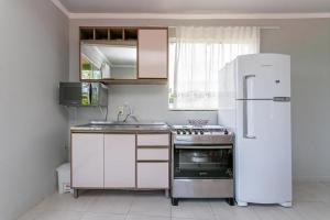 Η κουζίνα ή μικρή κουζίνα στο Pousada Residencial Marinho