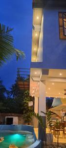 a house with a swimming pool next to a building at Cactus reef in Ahangama +9 photos