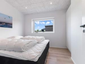 Postel nebo postele na pokoji v ubytování Luxury Retreat in Lokken - By Traum Ferienwohnungen