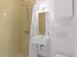 a bathroom with a sink and a shower at Luxury Retreat in Lokken - By Traum Ferienwohnungen in Løkken +18 photos