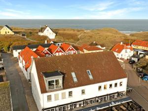 an aerial view of a town with houses and the ocean at Luxury Retreat in Lokken - By Traum Ferienwohnungen in Løkken