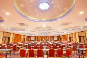 an empty conference room with tables and chairs at Saint Tropez Beach Hotel in Chao Lao Beach +76 photos