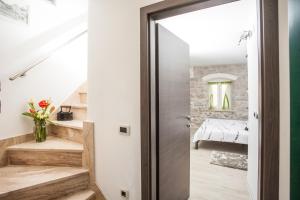 a hallway with a door leading to a bedroom at Apartments & Room Kartolina in Split +47 photos