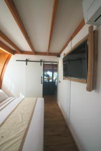 Tiki Beach Moorea , Piscine & Petit Déjeunerにあるベッド