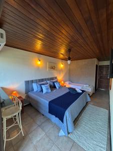 Postel nebo postele na pokoji v ubytování POUSO DE ICARO - POUSADA NO CENTRO de PARATY