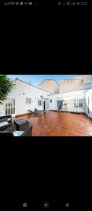 a large white building with a large courtyard at Torrebeach in Torre de la Horadada