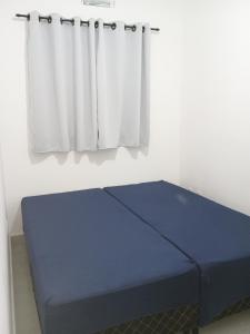 Ένα ή περισσότερα κρεβάτια σε δωμάτιο στο Casa de condomínio