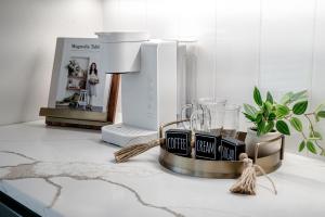 a kitchen counter with a blender on a counter top at The June Hot tub with king beds on 2 acres in Hot Springs