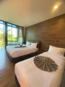 พบรักรีสอร์ท Pobruk resort客房内的一张或多张床位