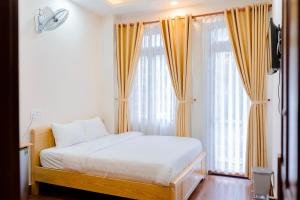 Postel nebo postele na pokoji v ubytování Mylan Hotel Đà Lạt by HOFs + 19 fotografií