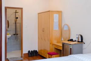 Postel nebo postele na pokoji v ubytování Mylan Hotel Đà Lạt by HOFs