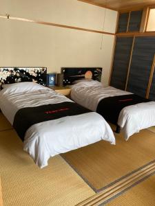 Postel nebo postele na pokoji v ubytování Private Lodging KASE 五所川原