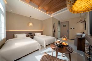 Katil atau katil-katil dalam bilik di Xueting Songjiangyue Hidden Courtyard Hotel