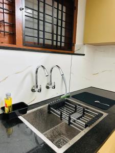 Dapur atau dapur kecil di Ammu's Homestay