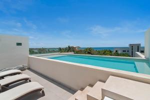 Bazén v ubytování Akumal Escape Beach Access 7 Pools With Ocean View Beach Club nebo v jeho okolí