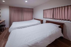 Postel nebo postele na pokoji v ubytování Home Stay COCCHI