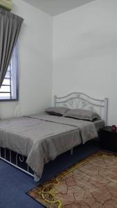 Ένα ή περισσότερα κρεβάτια σε δωμάτιο στο hananirich homestay