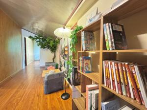 a room with book shelves filled with books at SAKURA House ĐÀ LẠT in Da Lat