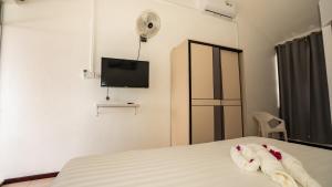 Uma cama ou camas num quarto em La Plage Residence
