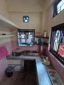 Kuchyň nebo kuchyňský kout v ubytování Dillen's Backpackers Inn