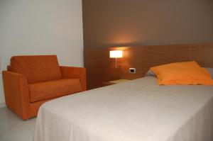 Posteľ alebo postele v izbe v ubytovaní Hotel Diego