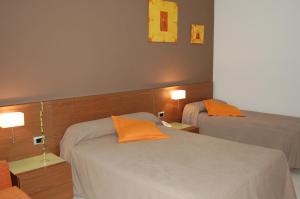 Posteľ alebo postele v izbe v ubytovaní Hotel Diego