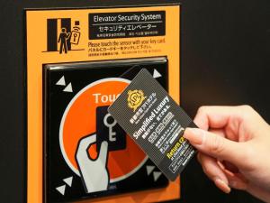 a person holding a credit card in a box at APA Hotel & Resort Osaka Namba Ekimae Tower in Osaka