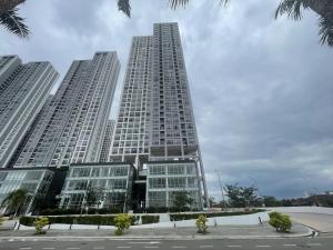 a tall building with three tall buildings at GYDEN STAYCATION #Midas SeriAlam near InternationalSchool & RegencyHospital in Masai