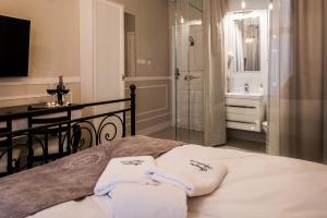Posteľ alebo postele v izbe v ubytovaní Imagine Apartments