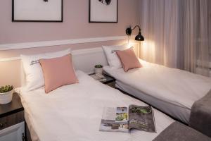Posteľ alebo postele v izbe v ubytovaní Imagine Apartments