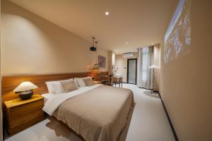 Postel nebo postele na pokoji v ubytování 厦门椿野酒店
