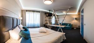 Кровать или кровати в номере Amrita Hotel