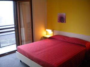Postel nebo postele na pokoji v ubytování Hotel Miramonti