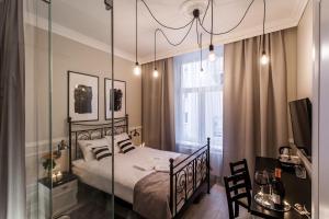 Posteľ alebo postele v izbe v ubytovaní Imagine Apartments