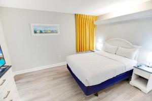 a hotel room with a bed and a television at Atlantica 753 in Myrtle Beach