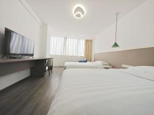 Postel nebo postele na pokoji v ubytování Shenzhen Xinghua Hotel + 33 fotografií