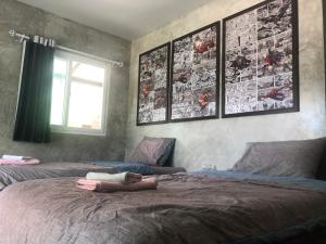 Postel nebo postele na pokoji v ubytování SolarCell Private Homestay - โซล่าเซลล์ไพรเวทโฮมสเตย์
