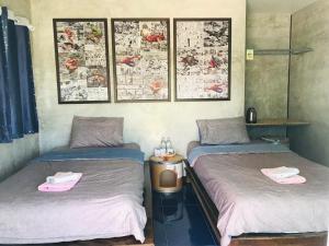 Postel nebo postele na pokoji v ubytování SolarCell Private Homestay - โซล่าเซลล์ไพรเวทโฮมสเตย์