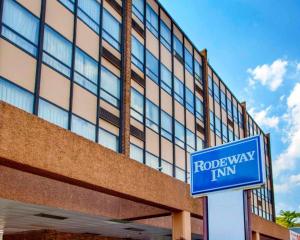 a blue street sign in front of a building at Rodeway Inn Meadowlands in Secaucus