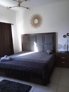 a bedroom with a large bed and a mirror at Casa con casa club en la Paz BCS in La Paz +16 photos