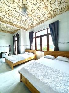 Postel nebo postele na pokoji v ubytování Thành Trinh hotel đảo Phú Quý