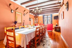 a dining room with a long table and chairs at Mas Vell in Catí