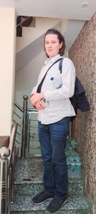 a woman standing on the stairs in a room at Hotel Ananya Inn in Varanasi +136 photos