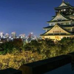 a large building with a city in the background at Mutsumi Konohana 601 むつみ庵此花 601 in Osaka