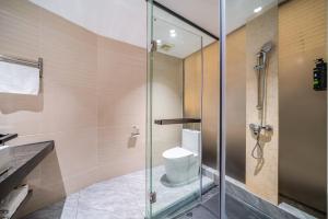 Koupelna v ubytování Mei Gang Hotel