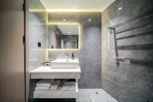 Koupelna v ubytování Mei Gang Hotel