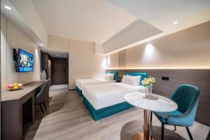 TV a/nebo společenská místnost v ubytování Mei Gang Hotel