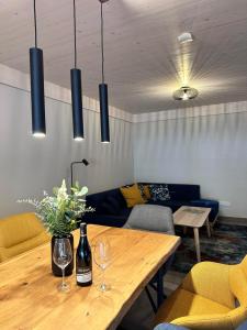 a living room with a table and a couch at Ferienhaus rausZeit in Dernau +14 photos