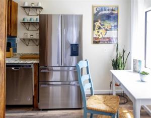 a kitchen with a stainless steel refrigerator at Sea La Vie in Fort Bragg