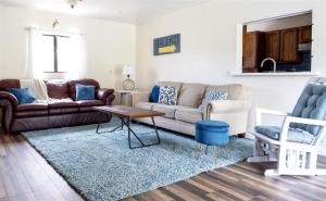 a living room with a couch and a table at Sea La Vie in Fort Bragg